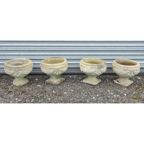 922 - Four matching reconstituted stone pedestal planters with bow and swag detail, each approx 13