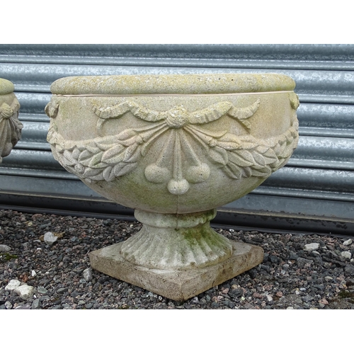 922 - Four matching reconstituted stone pedestal planters with bow and swag detail, each approx 13