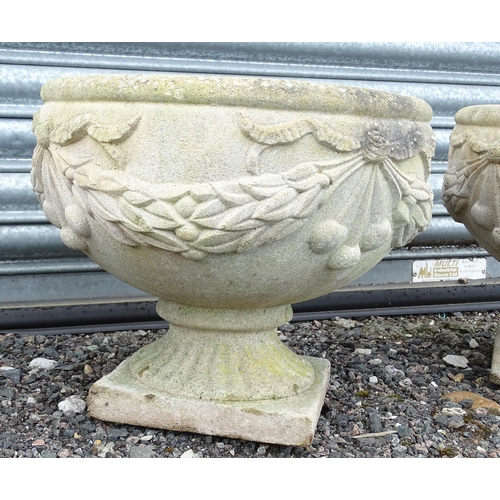 922 - Four matching reconstituted stone pedestal planters with bow and swag detail, each approx 13