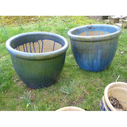 925 - Eight assorted blue glazed ceramic planters and plant pots, the largest 13 1/2