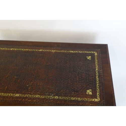 929 - A modern double pedestal writing desk with a gold tooled leather top. 48