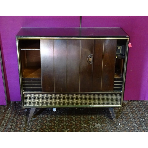 931 - A mid 20thC Grundig Radiogram , with turntable, tuner and microphone, approx 48