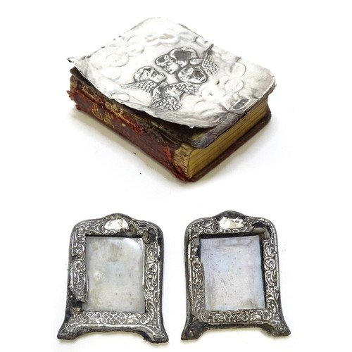 410 - A miniature prayer book with silver front cover with embossed angel detail. hallmarked Birmingham 19... 