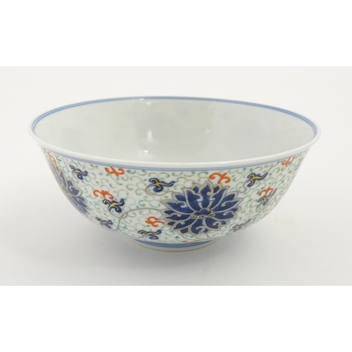 45 - A Chinese bowl decorated with scrolling floral and foliate detail. Character marks under. Approx. 3