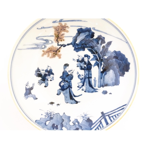 50 - A Chinese blue and white dish / bowl decorated with figures in a landscape. Character marks under. A... 