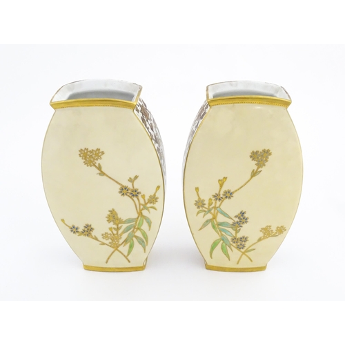 76 - A pair of Limoges Demartial and Tallandier vases of ovoid form decorated with exotic birds, flowers ... 