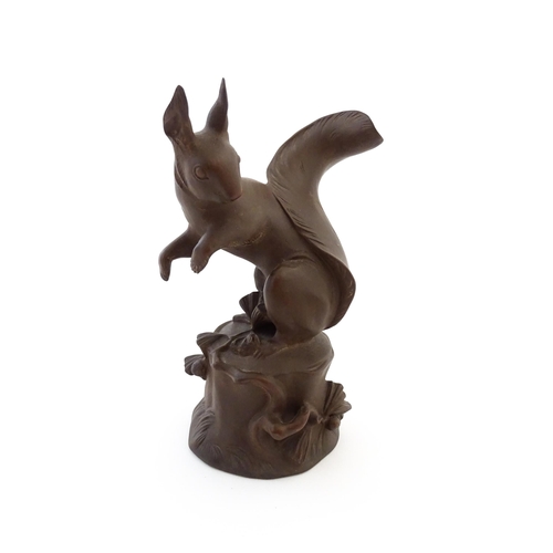 79 - A Bottger Steinzeug Meissen stoneware model of a squirrel perched on a tree stump. Marked under. App... 