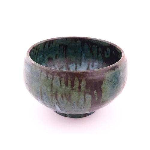 102 - A studio pottery bowl with drip glaze. Signed under R. Berrisford, 1959. Approx. 4 1/2