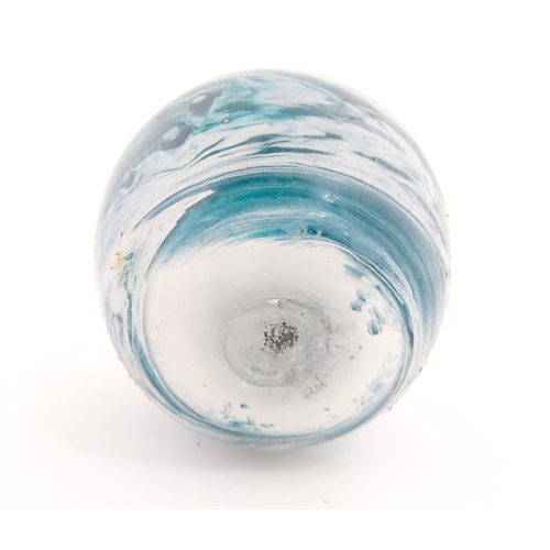 186 - An Isle of Scilly blue glass vase with twin handles and white mottled swirl detail, signed D. Lang w... 