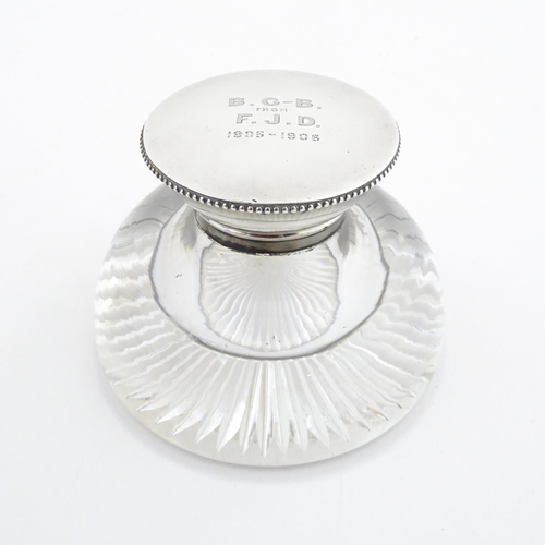 188 - A glass inkwell with silver top hallmarked London 1905 maker James Dudley and stamped J Dudley South... 