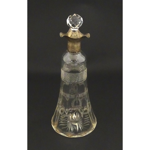 197 - A cut glass decanter with silver mounts hallmarked Birmingham 1911. Approx. 9 1/4