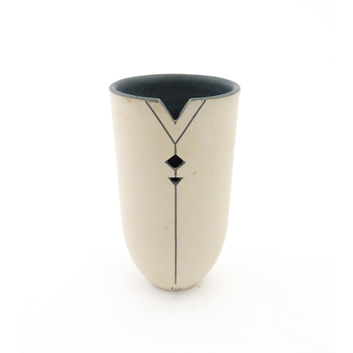 100 - A studio pottery vase by Louise Darby with pierced geometric detail. Signed with impressed monogram ... 