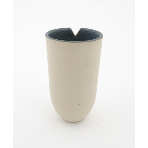 100 - A studio pottery vase by Louise Darby with pierced geometric detail. Signed with impressed monogram ... 