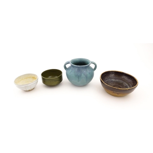 101 - Four items of studio pottery to include an Upchurch twin handled pot, a small bowl by Geoffrey Small... 