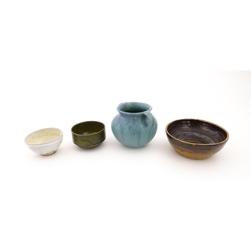 101 - Four items of studio pottery to include an Upchurch twin handled pot, a small bowl by Geoffrey Small... 