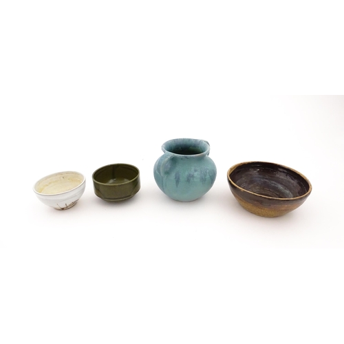 101 - Four items of studio pottery to include an Upchurch twin handled pot, a small bowl by Geoffrey Small... 