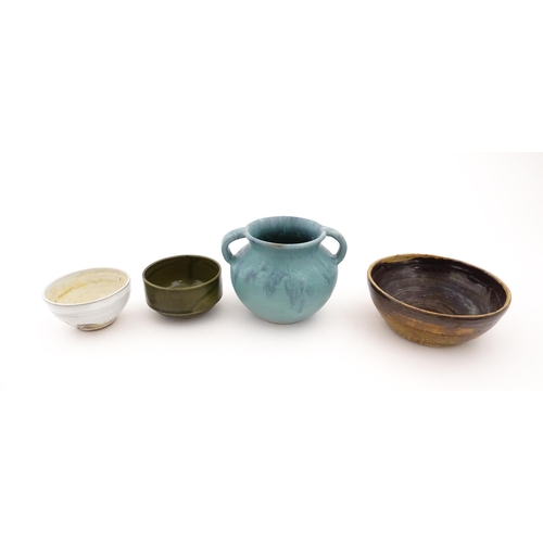 101 - Four items of studio pottery to include an Upchurch twin handled pot, a small bowl by Geoffrey Small... 