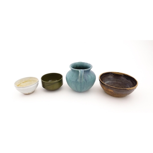 101 - Four items of studio pottery to include an Upchurch twin handled pot, a small bowl by Geoffrey Small... 