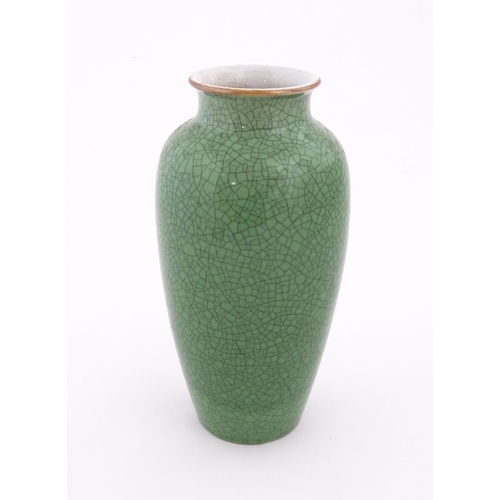 4 - A Chinese vase with a green crackle glaze. Approx. 10 1/4