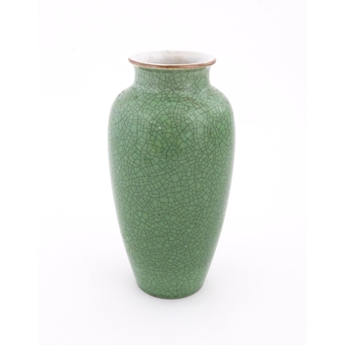 4 - A Chinese vase with a green crackle glaze. Approx. 10 1/4