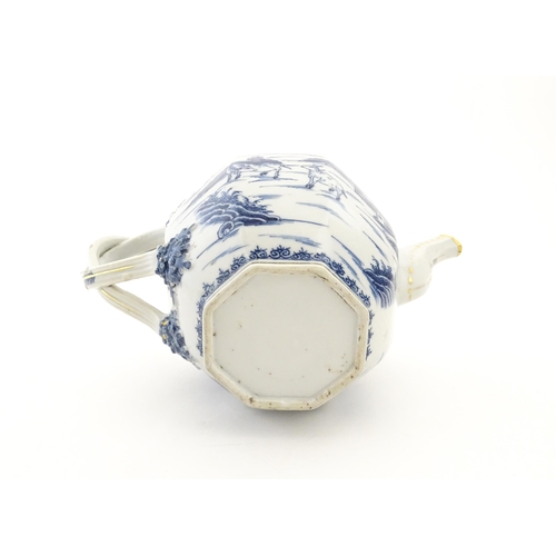 62 - A Chinese export blue and white teapot decorated with figures and water buffalo in a landscape with ... 