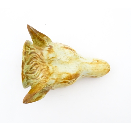 65 - A creamware stirrup cup formed as a fox head, in the manner of Whieldon. Approx. 4 3/4