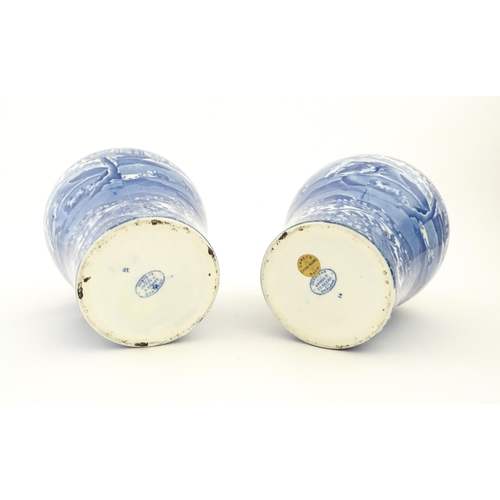 74 - A pair of Copeland blue and white lidded vases decorated in Spode's Italian pattern depicting figure... 