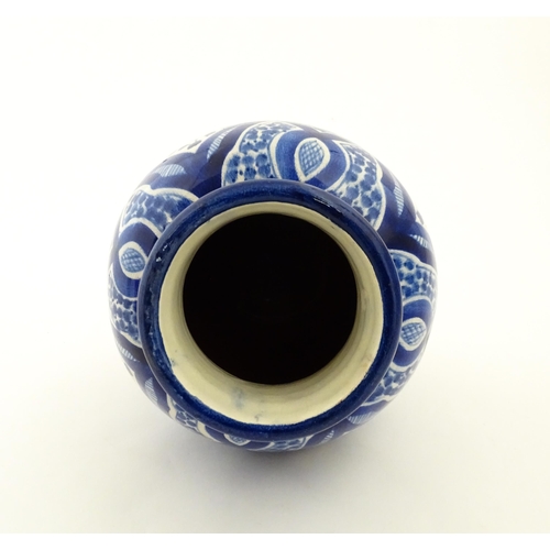 92 - A Continental blue and white vase of baluster form with brushwork decoration. Approx. 9 1/4