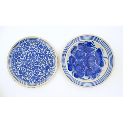 93 - A Continental faience bowl with blue and white detail floral detail and banded border. Together with... 