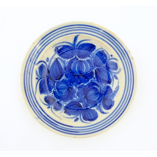 93 - A Continental faience bowl with blue and white detail floral detail and banded border. Together with... 