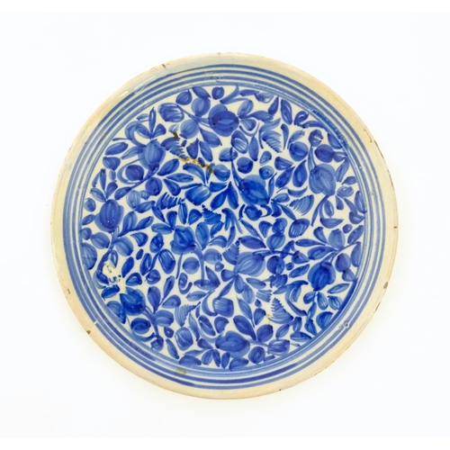 93 - A Continental faience bowl with blue and white detail floral detail and banded border. Together with... 