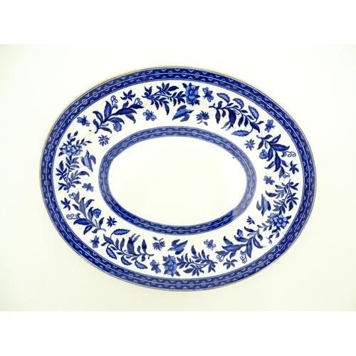 94 - A Charles Ford blue and white plate decorated with flowers, foliage, birds and insects. Marked under... 