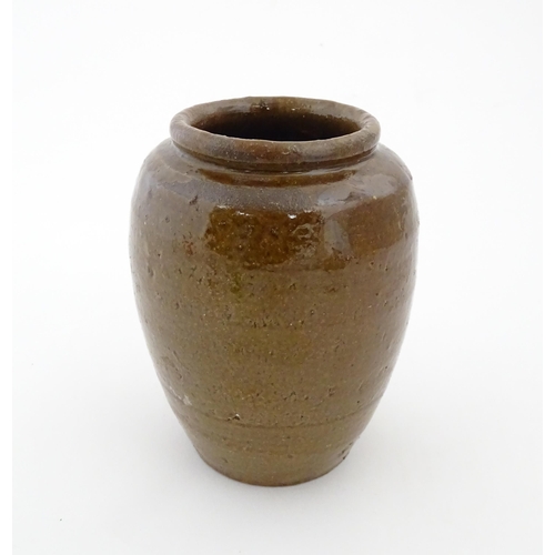 96 - A stoneware vase / pot of tapering form with script detail. Approx. 6 1/4