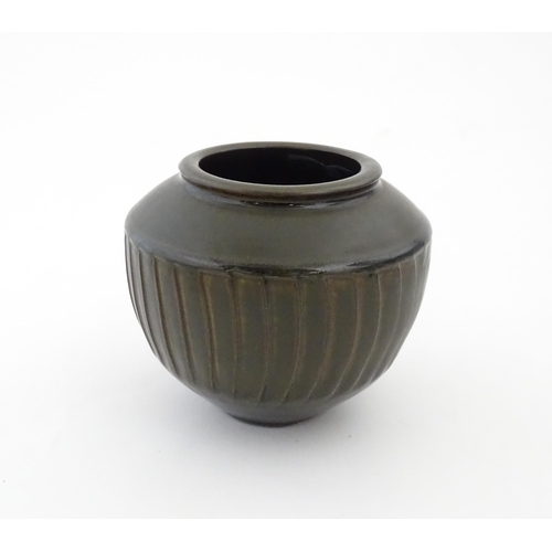 97 - A David Leach studio pottery vase / pot of tapering form with a unique gunmetal glaze commissioned b... 