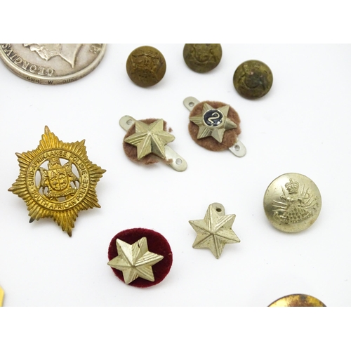 924 - Militaria : a quantity of 20thC medals and insignia,  comprising two WWI campaign medals to Gnr. W. ... 