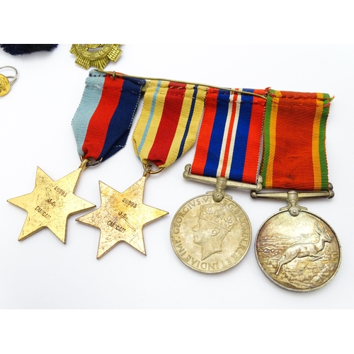 924 - Militaria : a quantity of 20thC medals and insignia,  comprising two WWI campaign medals to Gnr. W. ... 