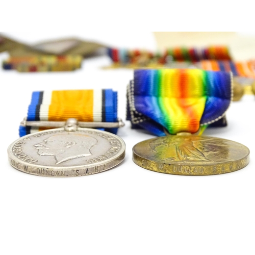 924 - Militaria : a quantity of 20thC medals and insignia,  comprising two WWI campaign medals to Gnr. W. ... 