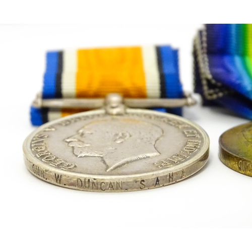 924 - Militaria : a quantity of 20thC medals and insignia,  comprising two WWI campaign medals to Gnr. W. ... 