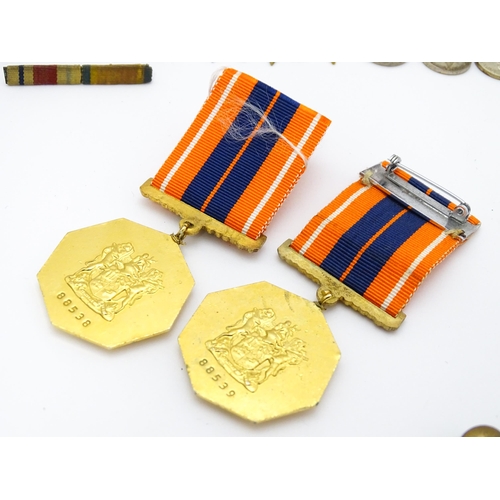 924 - Militaria : a quantity of 20thC medals and insignia,  comprising two WWI campaign medals to Gnr. W. ... 