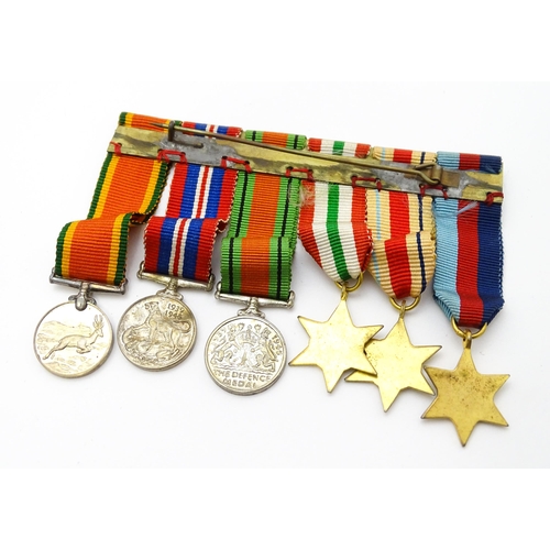 924 - Militaria : a quantity of 20thC medals and insignia,  comprising two WWI campaign medals to Gnr. W. ... 