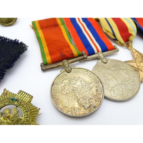 924 - Militaria : a quantity of 20thC medals and insignia,  comprising two WWI campaign medals to Gnr. W. ... 