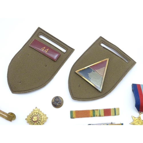 924 - Militaria : a quantity of 20thC medals and insignia,  comprising two WWI campaign medals to Gnr. W. ... 