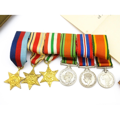 924 - Militaria : a quantity of 20thC medals and insignia,  comprising two WWI campaign medals to Gnr. W. ... 