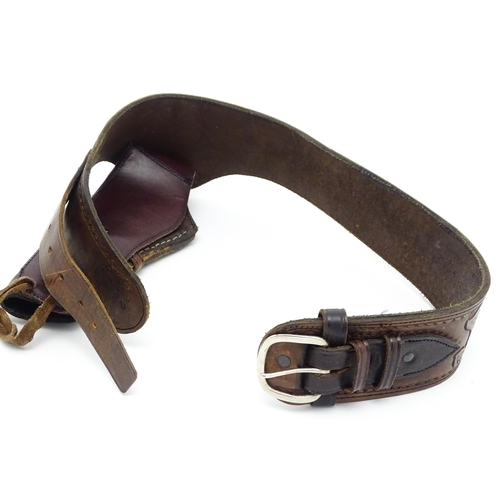 934 - Militaria: a western pistol belt / bandolier with holster and provision for 11 bullets, the leather ... 