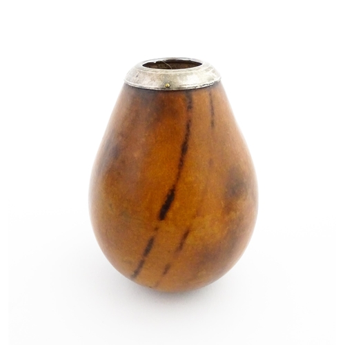 1077 - A 20thC carved gourd mate cup / pot with silver rim hallmarked London 1925. Approx. 3 1/2