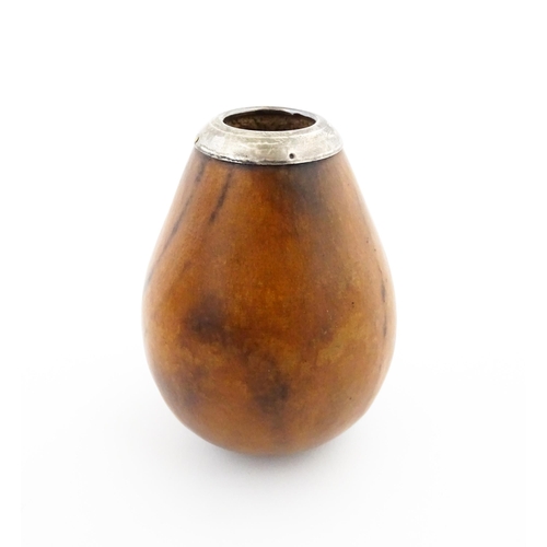 1077 - A 20thC carved gourd mate cup / pot with silver rim hallmarked London 1925. Approx. 3 1/2