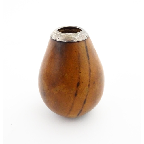 1077 - A 20thC carved gourd mate cup / pot with silver rim hallmarked London 1925. Approx. 3 1/2