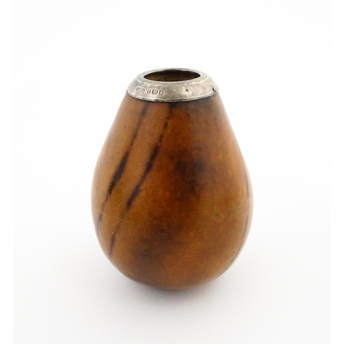 1077 - A 20thC carved gourd mate cup / pot with silver rim hallmarked London 1925. Approx. 3 1/2