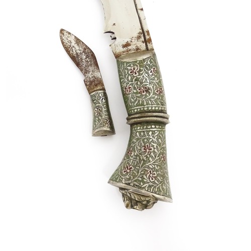 1153 - A Malaysian kukri knife, with engraved floral and foliate handle with lion mask detail to end. The r... 