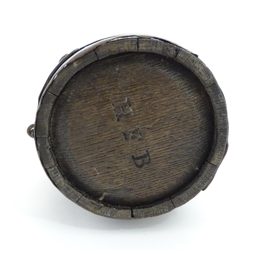 1165 - A Victorian coopered oak barrel with swing. With initials HFB to one end. Approx. 9